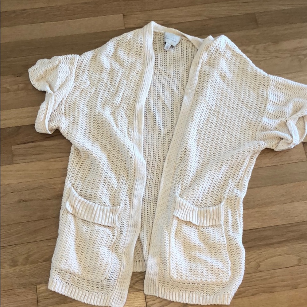 Mid arm, knit throw over sweater